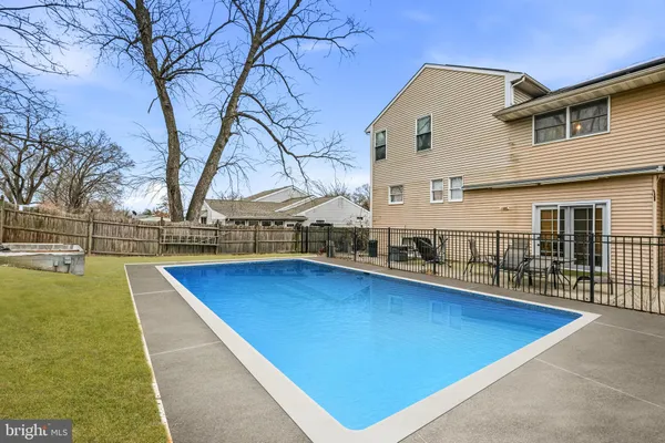 a view of swimming pool with outdoor seating and deck