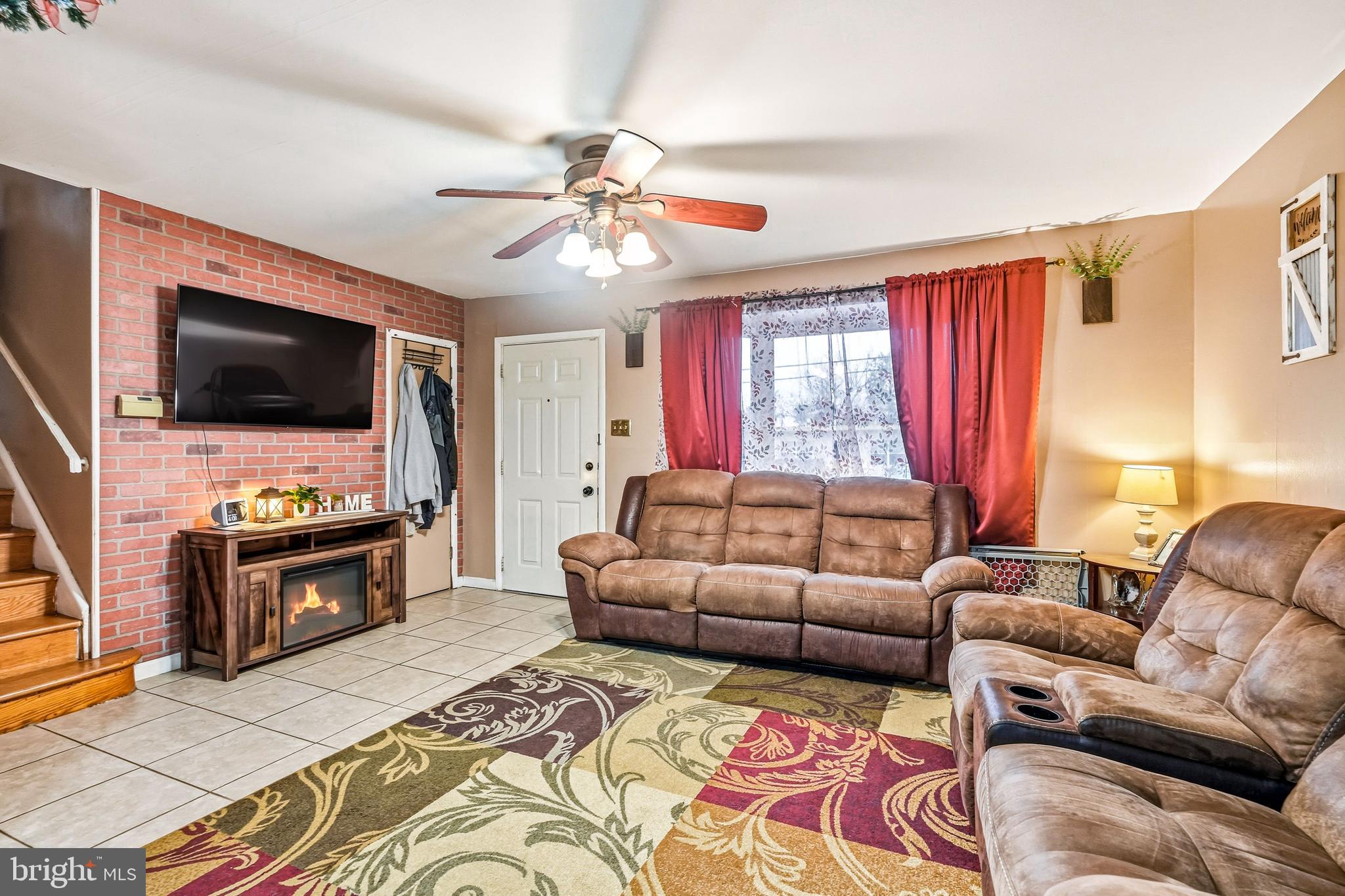 313 Ogden Station Road Wenonah, NJ 08090 - Photo 3 of 40 a living room with furniture and a flat screen tv