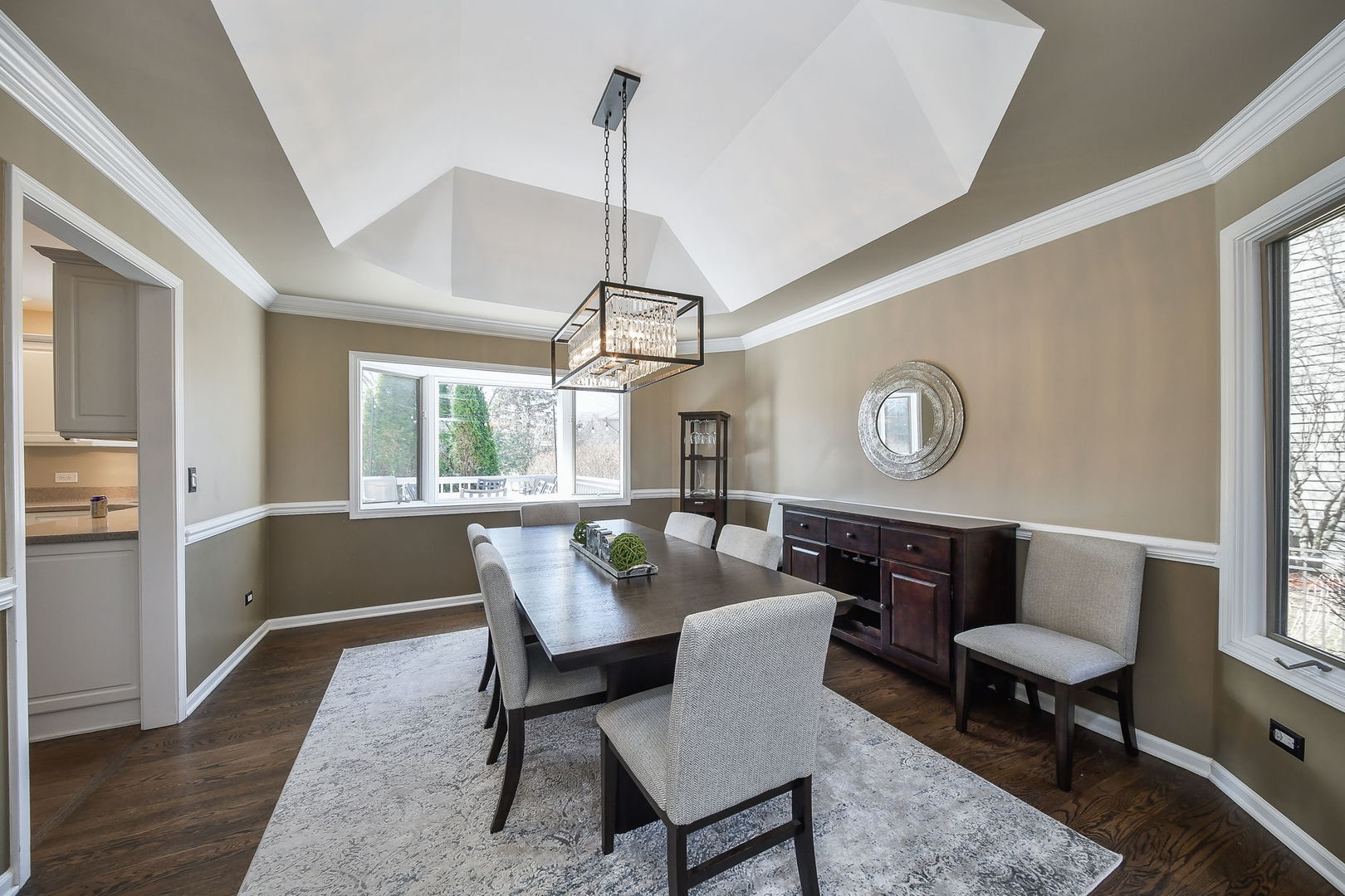1325 Fagan Road Batavia, IL 60510 - Photo 10 of 32 a dining room with wooden floor a chandelier a wooden table and chairs