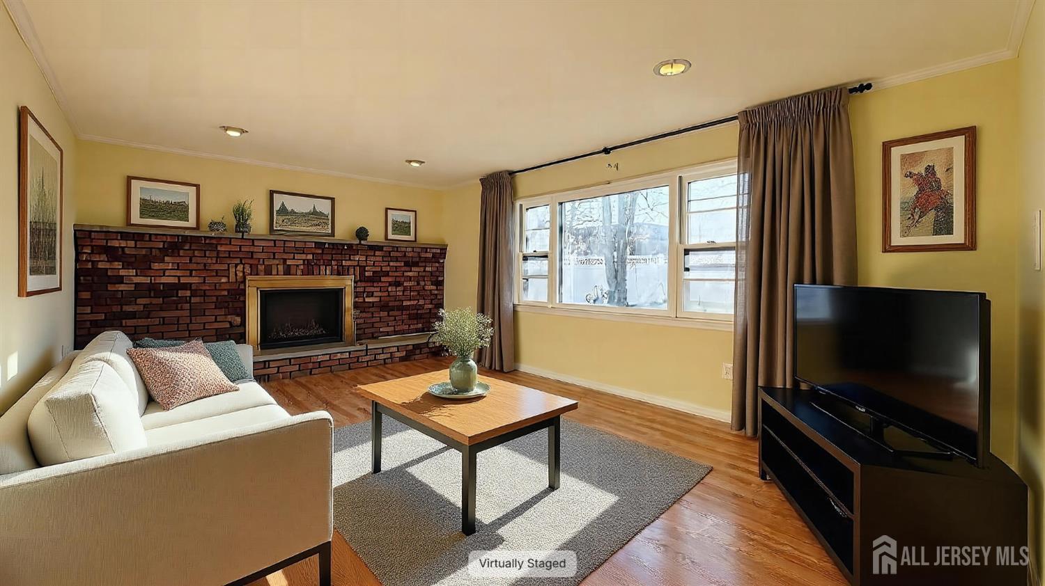 9 Stratford Circle Edison, NJ 08820 - Photo 12 of 38 a living room with furniture a flat screen tv and a fireplace