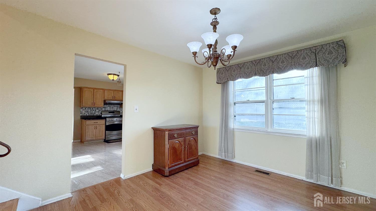 9 Stratford Circle Edison, NJ 08820 - Photo 18 of 38 a view of a livingroom with a chandelier furniture and windows