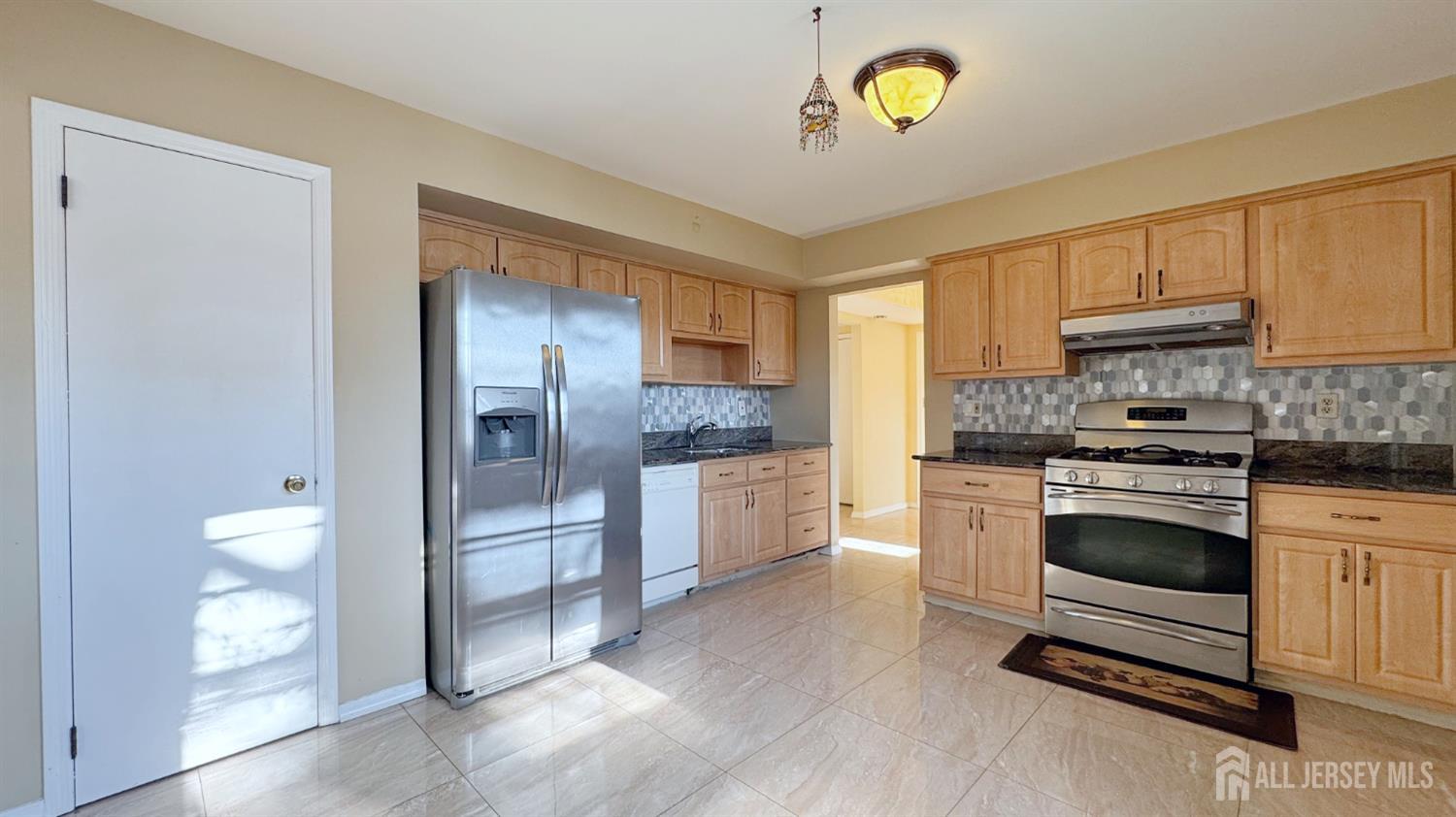 9 Stratford Circle Edison, NJ 08820 - Photo 19 of 38 a kitchen with a refrigerator and a stove top oven