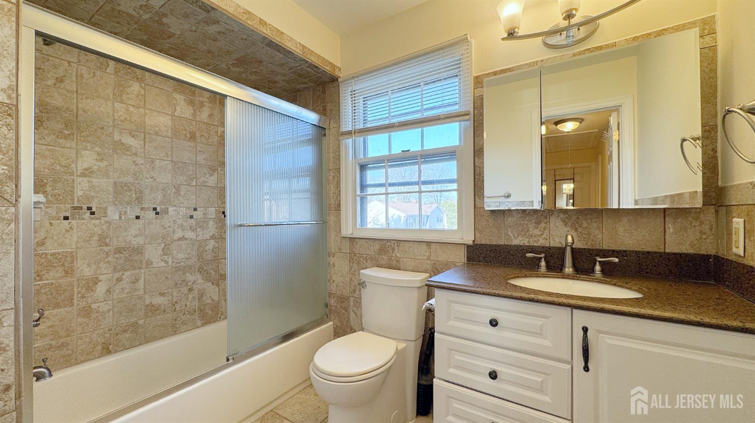 9 Stratford Circle Edison, NJ 08820 - Photo 24 of 38 a bathroom with a granite countertop sink toilet and shower