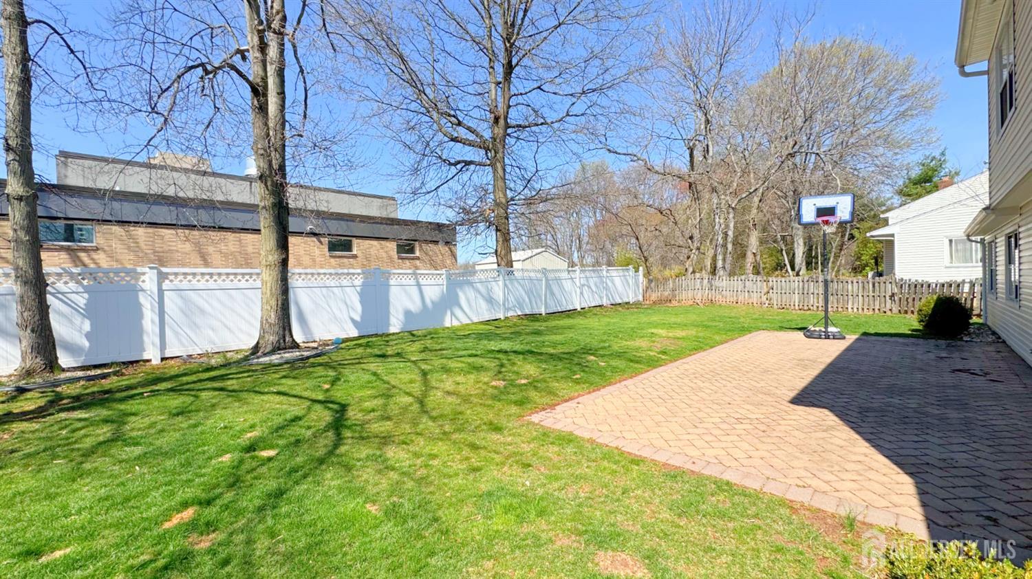 9 Stratford Circle Edison, NJ 08820 - Photo 36 of 38 a view of a backyard with a large tree