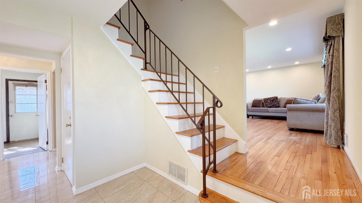 9 Stratford Circle Edison, NJ 08820 - Photo 6 of 38 a view of entryway and hall with wooden floor