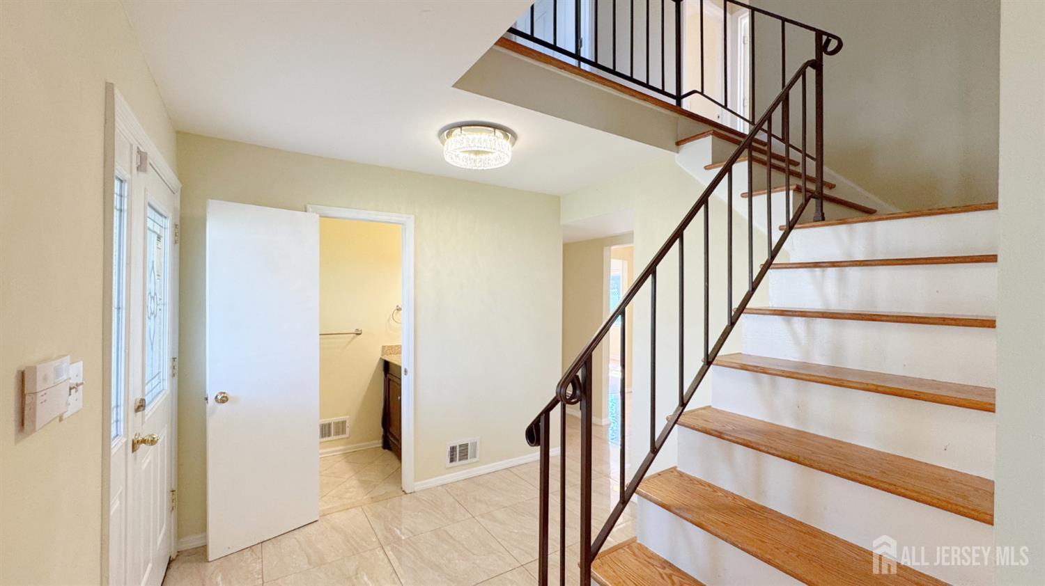 9 Stratford Circle Edison, NJ 08820 - Photo 7 of 38 a view of an entryway with wooden floor