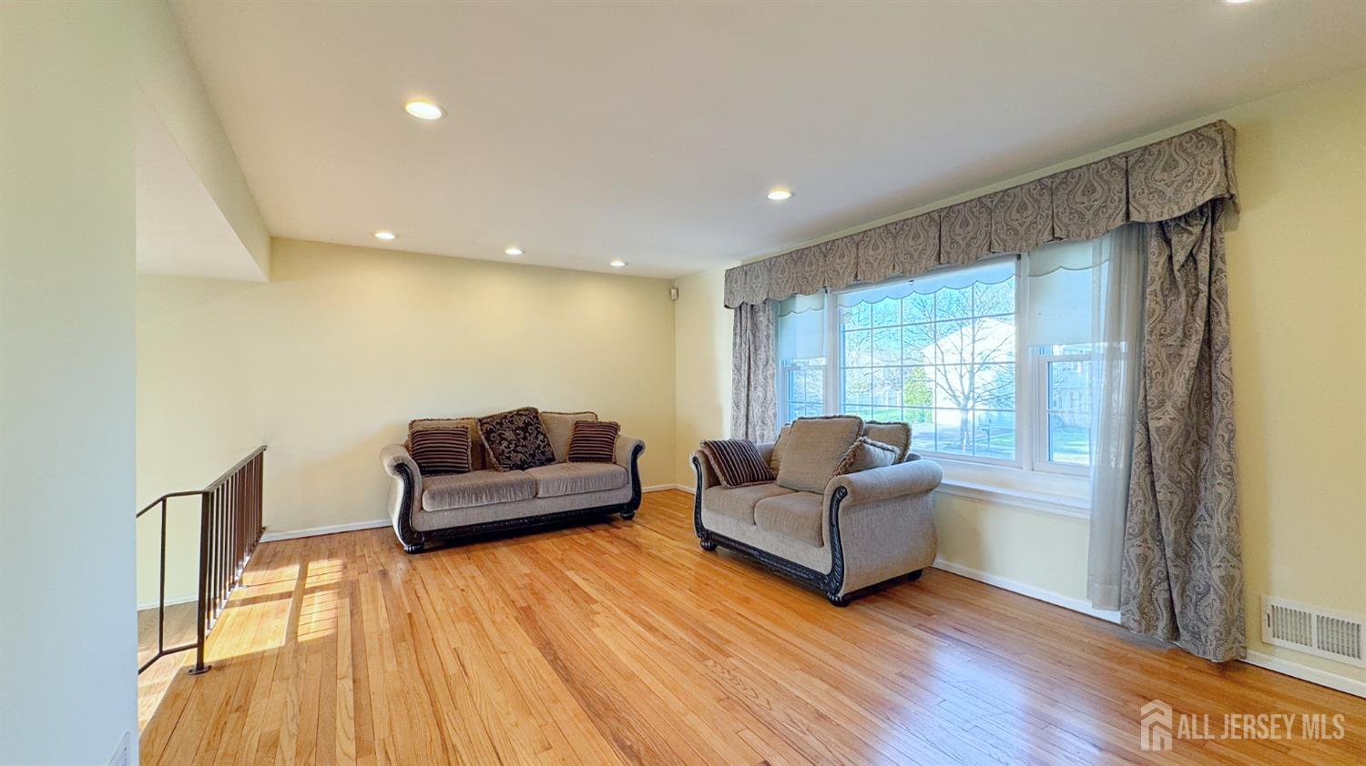 9 Stratford Circle Edison, NJ 08820 - Photo 8 of 38 a living room with furniture and a large window