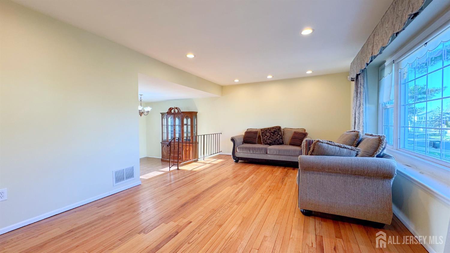 9 Stratford Circle Edison, NJ 08820 - Photo 10 of 38 a living room with furniture and wooden floor