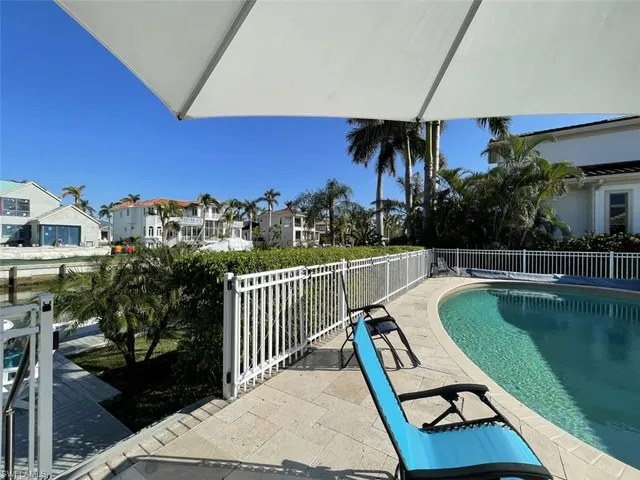 a view of a balcony with chairs