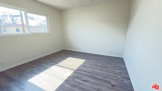 a bathroom with a sink a toilet and a large mirror