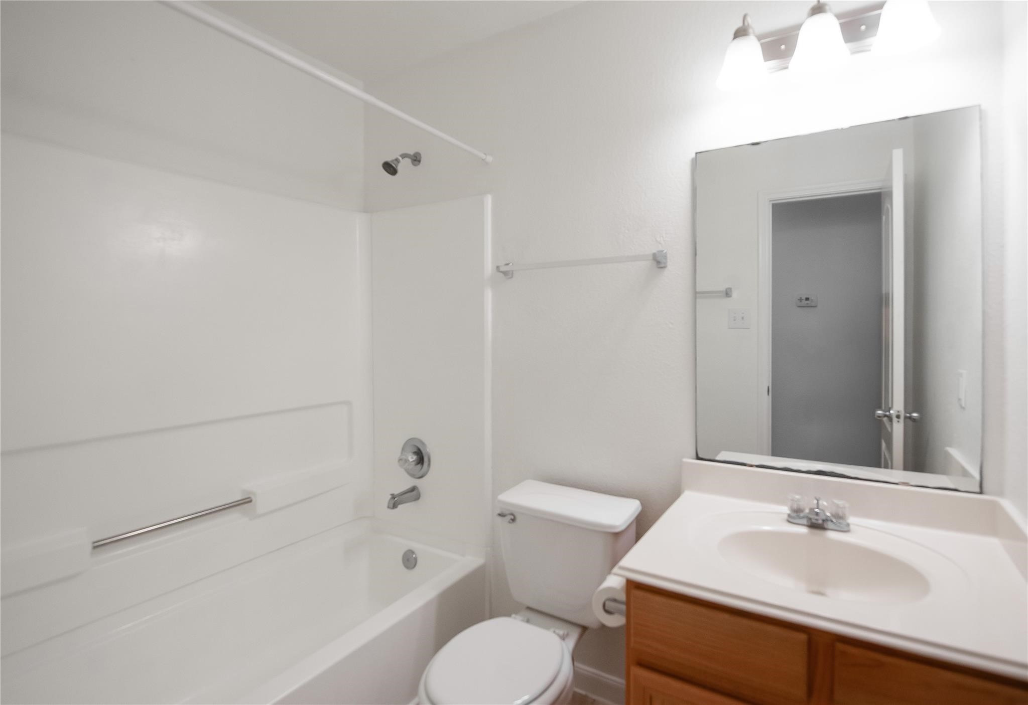 16310 Chandler Ridge Lane Cypress, TX 77429 - Photo 20 of 25 a bathroom with a sink toilet and shower