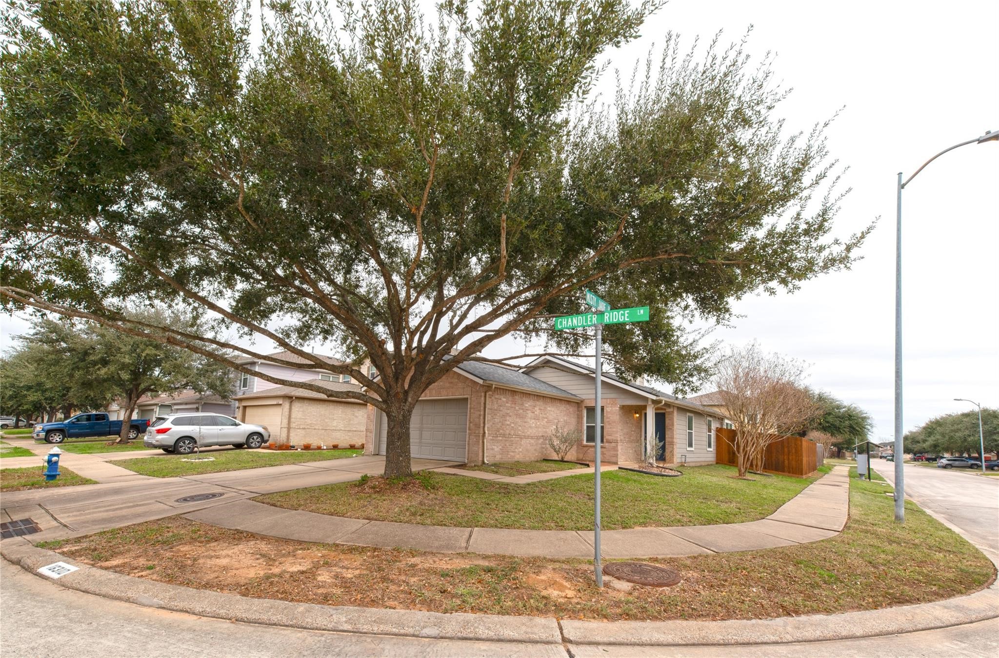 16310 Chandler Ridge Lane Cypress, TX 77429 - Photo 25 of 25 a view of a road with a house in the background