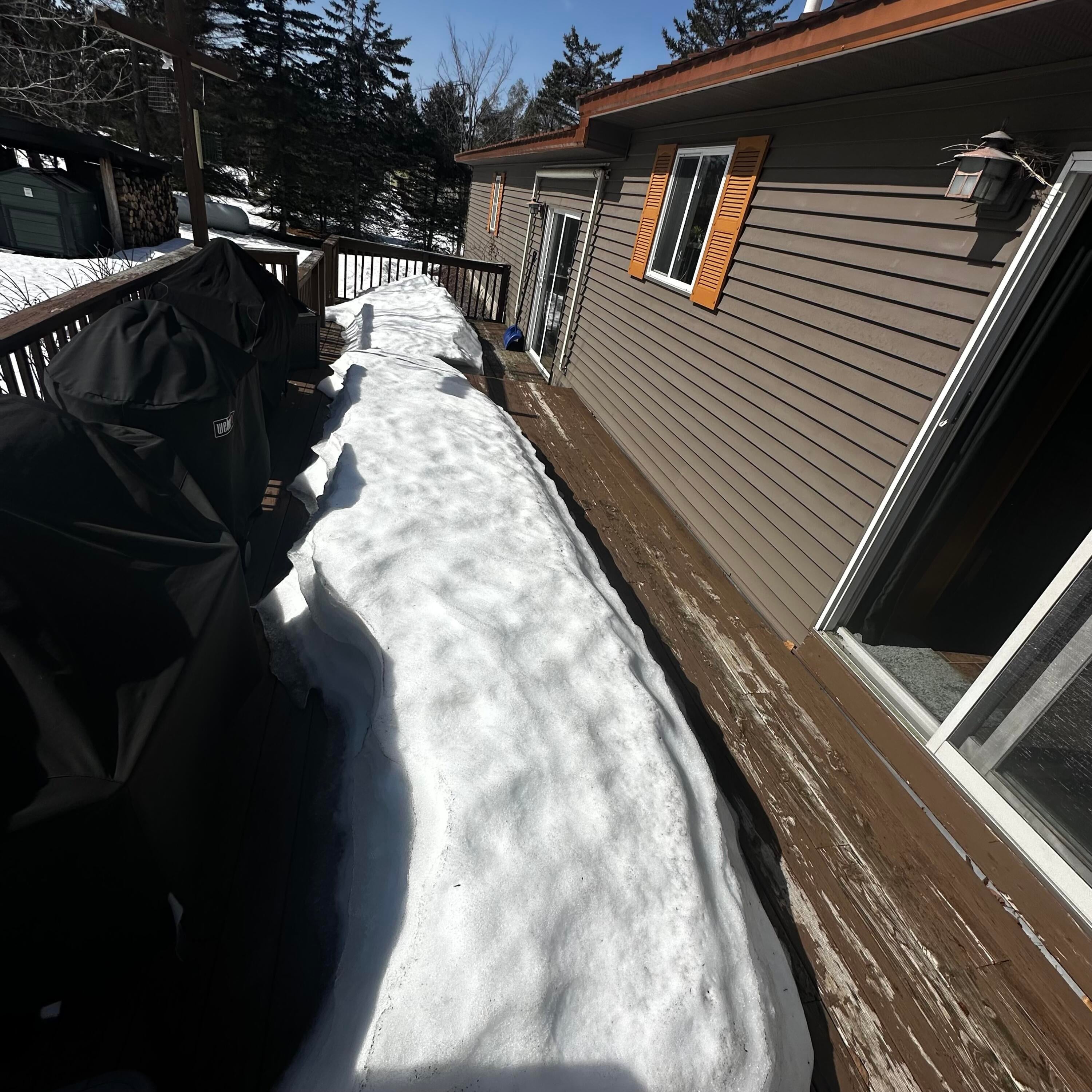 3821 Allis Road Gaylord, MI 49735 - Photo 19 of 25 The large back deck has two access points (entry way and dining room) and a retractable sunshade awning built into the home.
