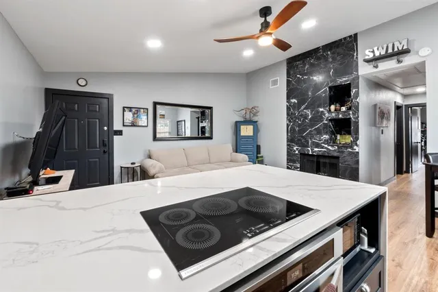 a kitchen with a stove a refrigerator and a stove