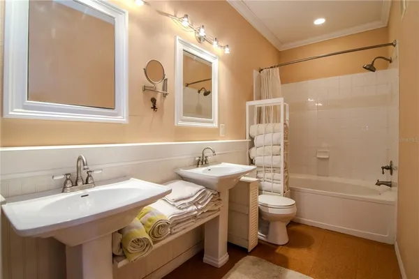 a bathroom with a sink toilet tub and shower