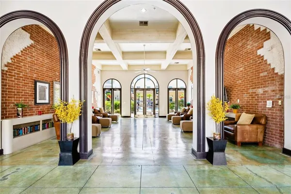 a view of hall way with furniture