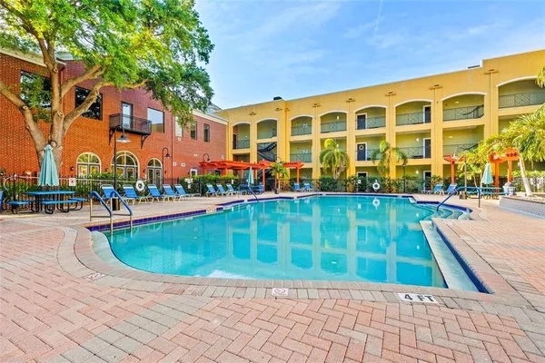 a view of swimming pool with outdoor seating