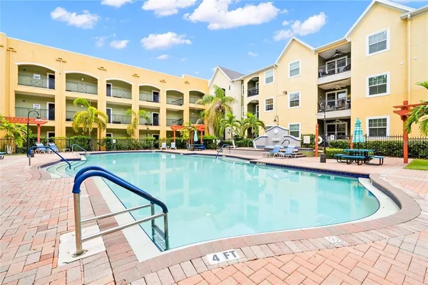 a view of a swimming pool with lounge chair