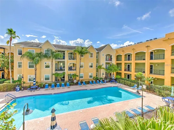 a view of a swimming pool with a lounge chairs