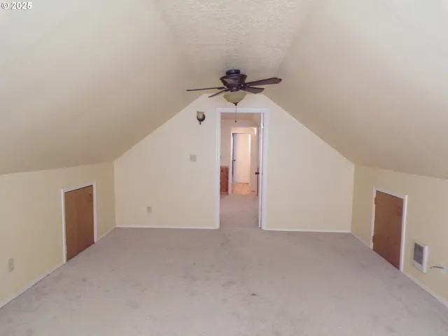 a view of a hallway with a chandelier