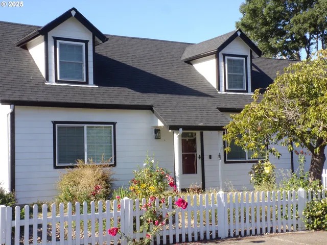 a front view of house a flowers