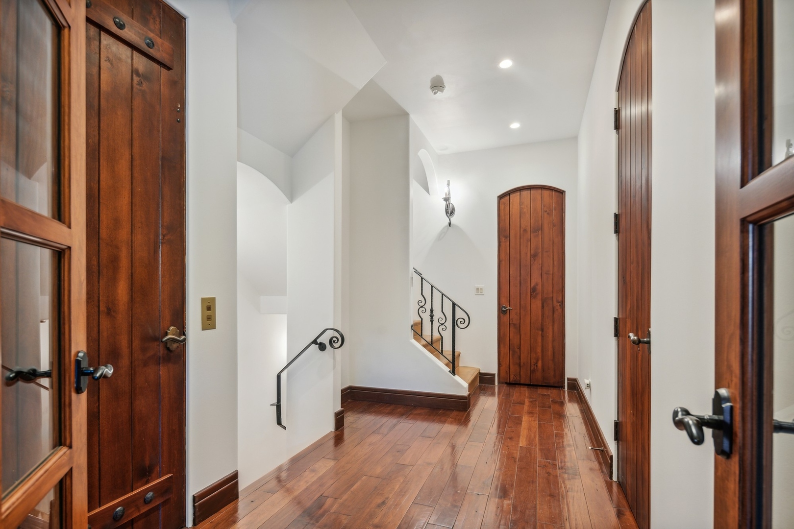 240 Spring Avenue Naperville, IL 60540 - Photo 16 of 43 a view of front door with wooden floor and stairs