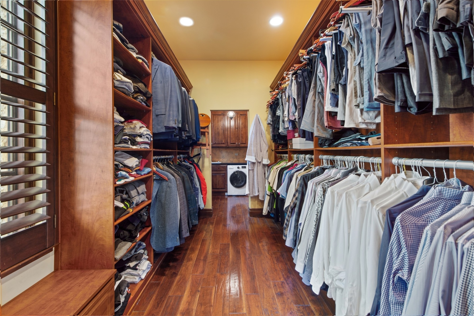 240 Spring Avenue Naperville, IL 60540 - Photo 22 of 43 a view of walk in closet with clothes and shoes