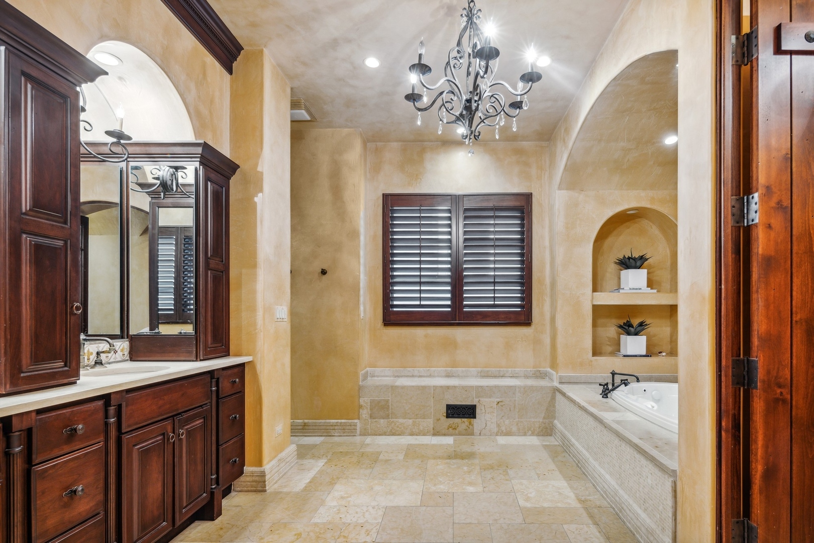 240 Spring Avenue Naperville, IL 60540 - Photo 23 of 43 a spacious bathroom with a sink a large mirror and a bathtub