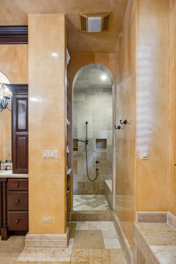 240 Spring Avenue Naperville, IL 60540 - Photo 25 of 43 a bathroom with a glass door shower