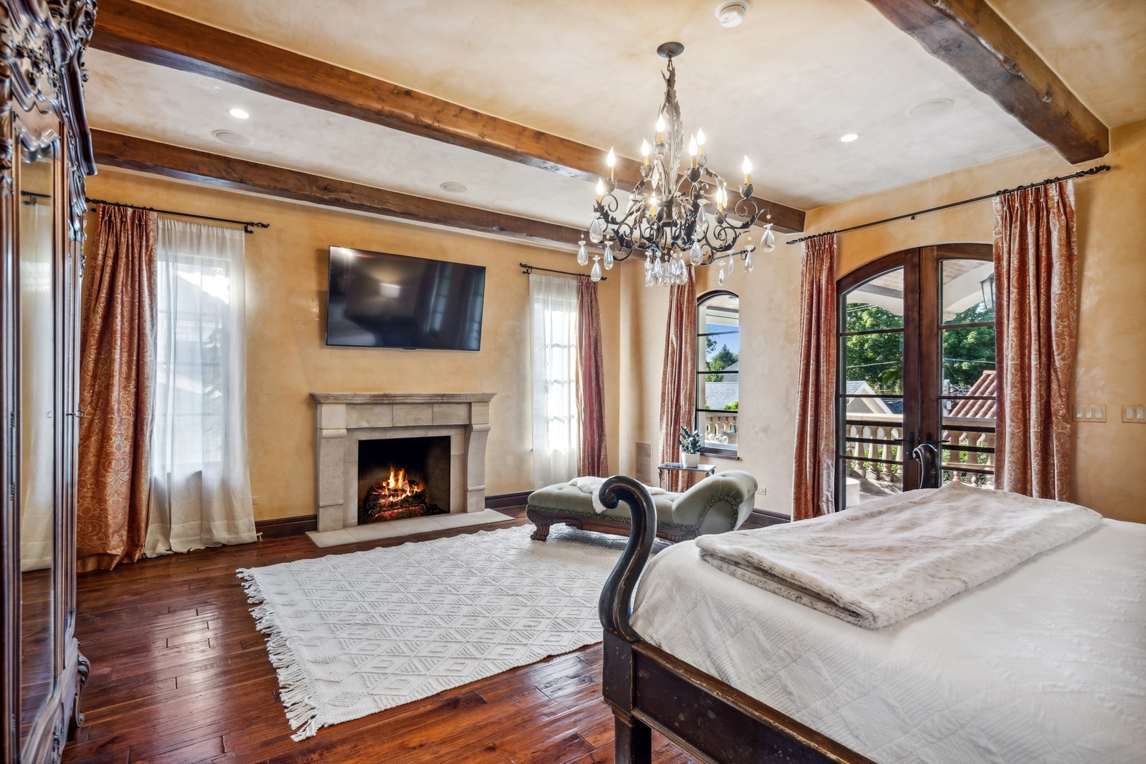 240 Spring Avenue Naperville, IL 60540 - Photo 27 of 43 a spacious bedroom with a bed and a flat screen tv