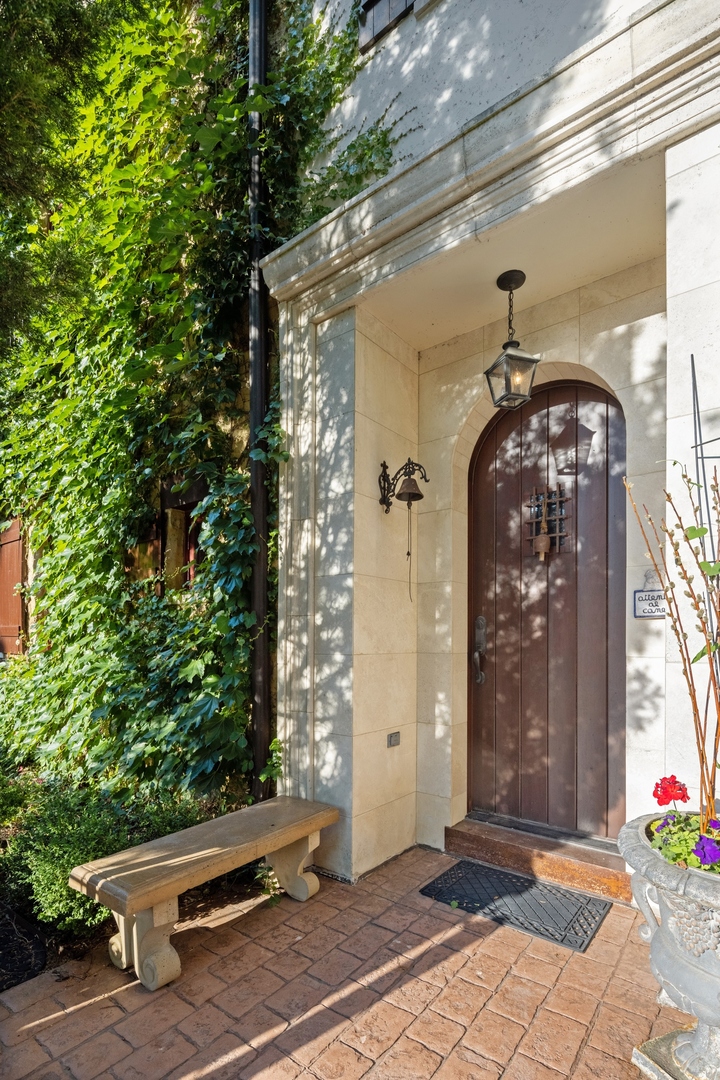 240 Spring Avenue Naperville, IL 60540 - Photo 3 of 43 a front view of a house with garden