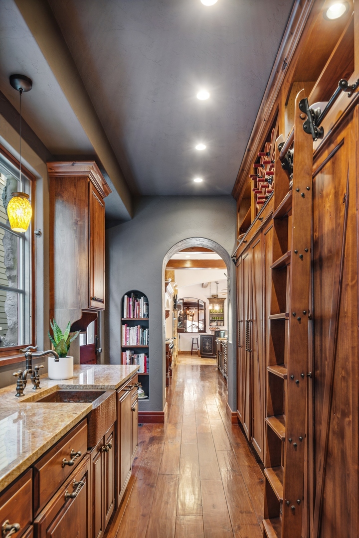 240 Spring Avenue Naperville, IL 60540 - Photo 10 of 43 a view of a hallway view with wooden floor and staircase