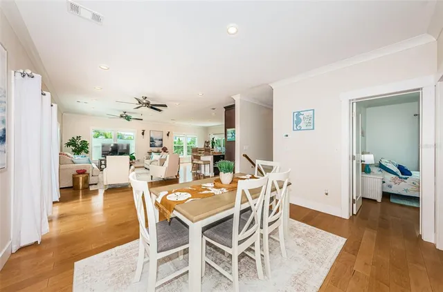 a view of a dining room with furniture window and wooden floor