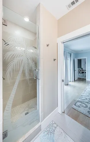 a bathroom with a shower and a sink