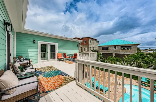 a view of a house with wooden deck