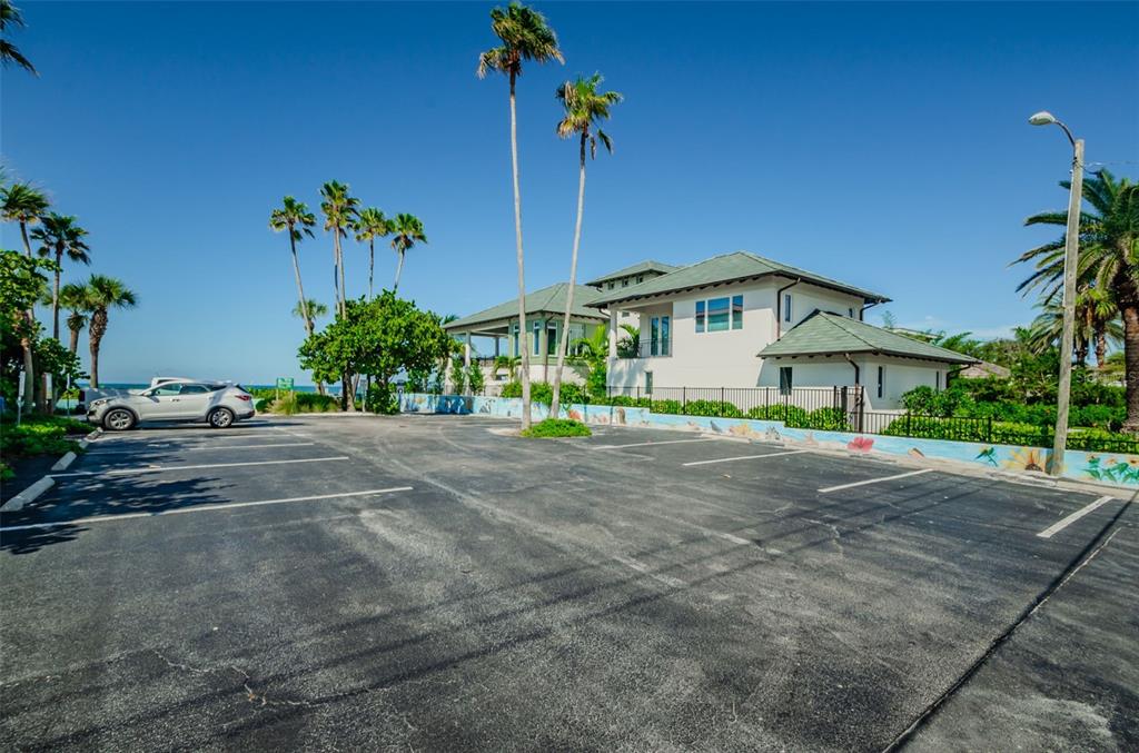 16109 3rd Street East Redington Beach, FL 33708 - Photo 23 of 25 a front view of a house with a yard and garage