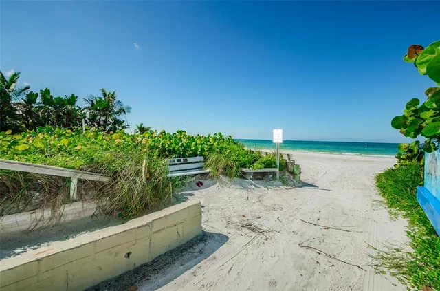 a view of a pathway with a bench