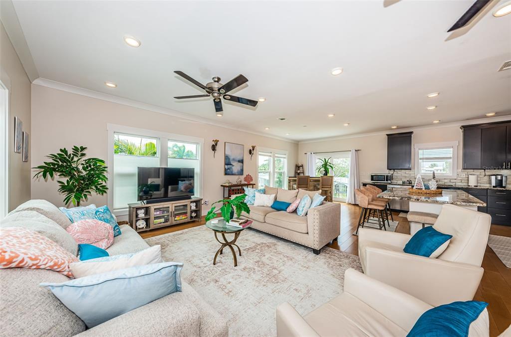 16109 3rd Street East Redington Beach, FL 33708 - Photo 3 of 25 a living room with furniture and a flat screen tv