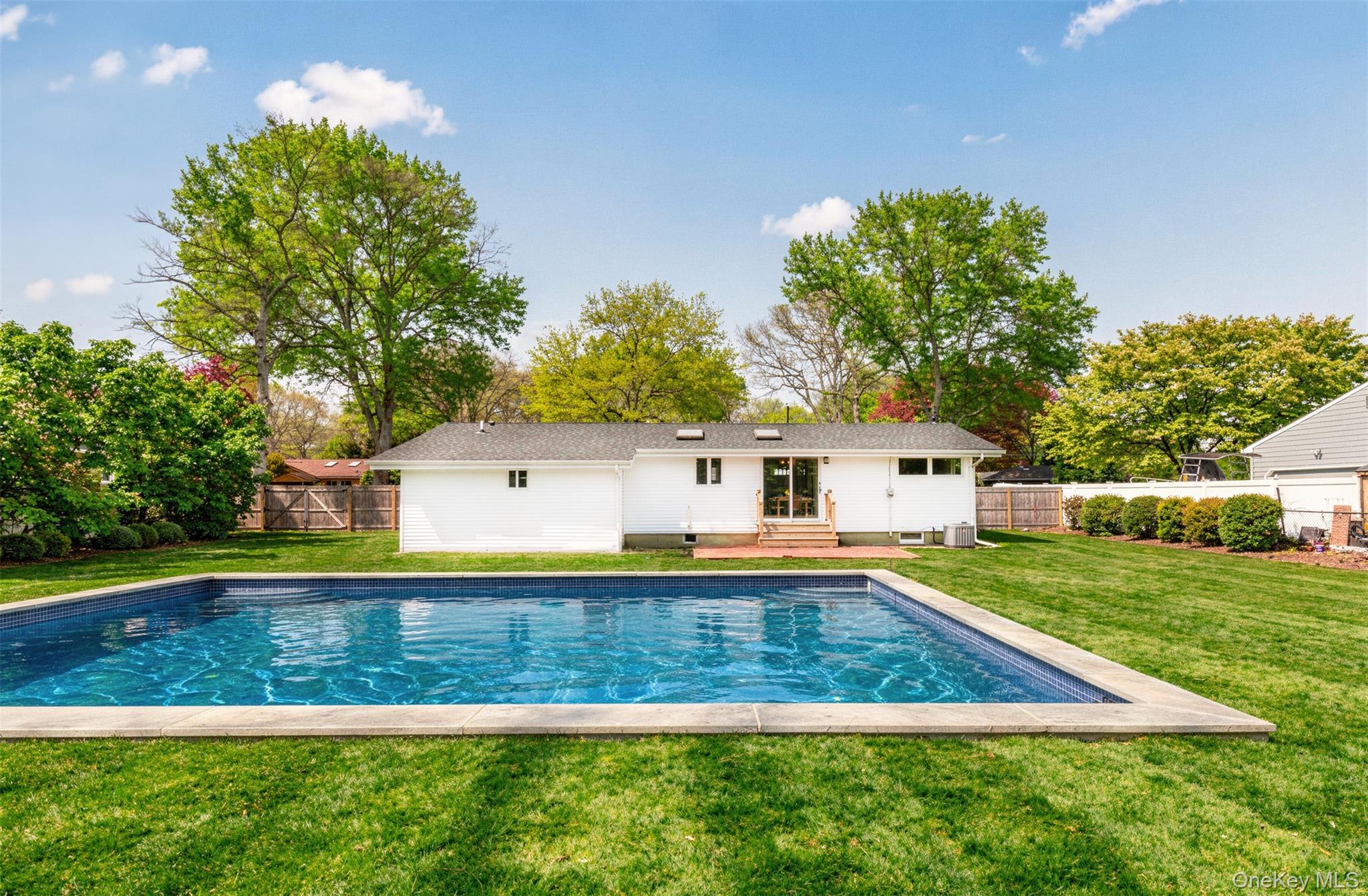 58 North Howells Point Road Bellport, NY 11713 - Photo 16 of 16 Pool digitally enhanced as it was still being built at time of photos.