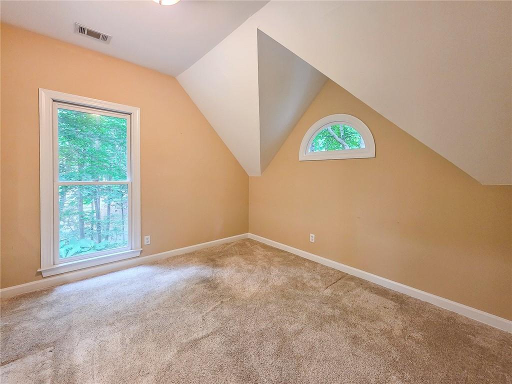 3712 Frederica Road Northwest Berkeley Lake, GA 30096 - Photo 26 of 49 an empty room with a window