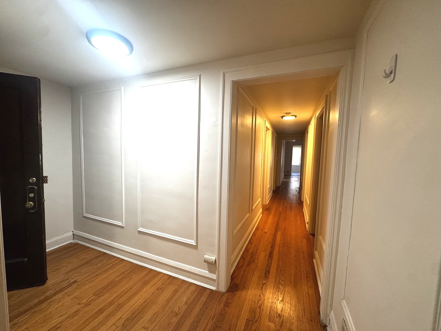 6937 South Merrill Avenue Chicago, IL 60649 - Photo 5 of 15 a view of a room with wooden floor