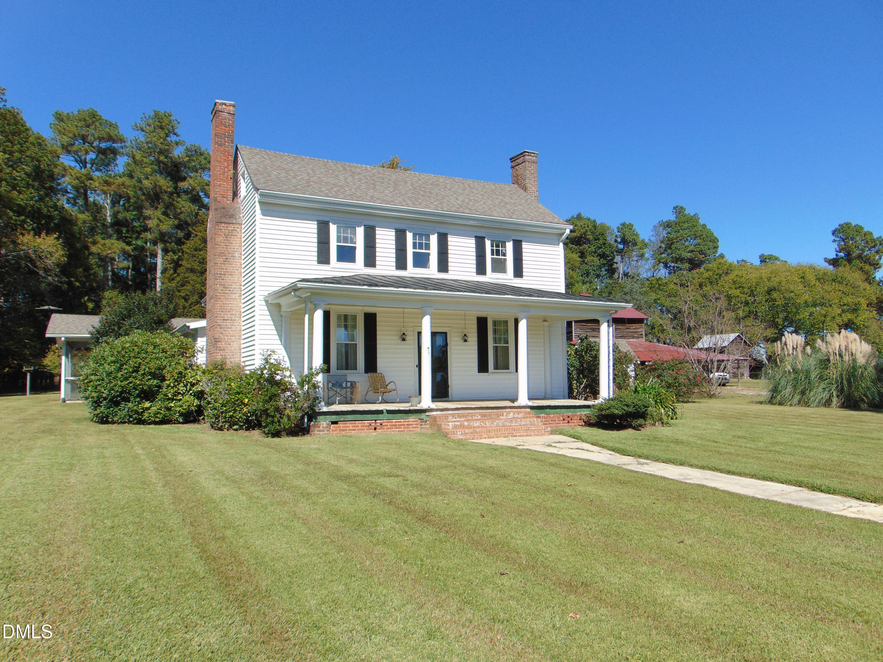 4067 Chewning Road Oxford, NC 27565 - Photo 40 of 82 a front view of a house with a yard
