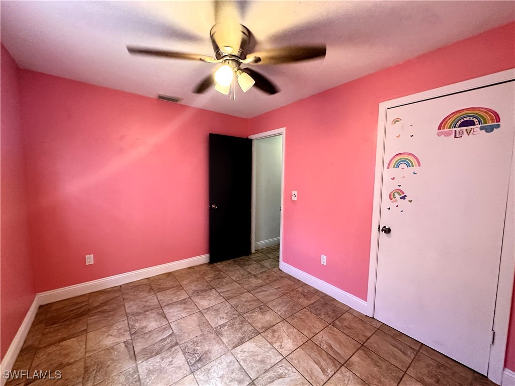818 Sheldon Avenue Lehigh Acres, FL 33936 - Photo 20 of 43 a view of an empty room
