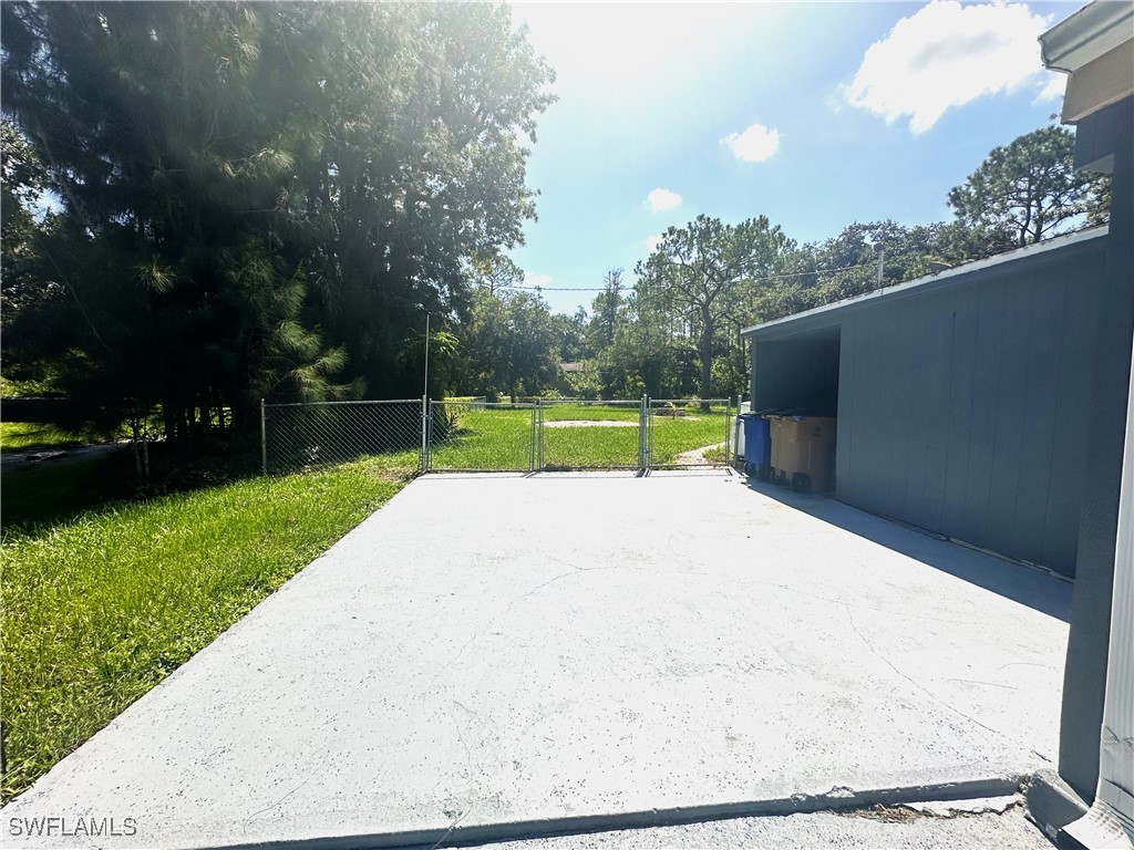 818 Sheldon Avenue Lehigh Acres, FL 33936 - Photo 7 of 43 a view of outdoor space with garden