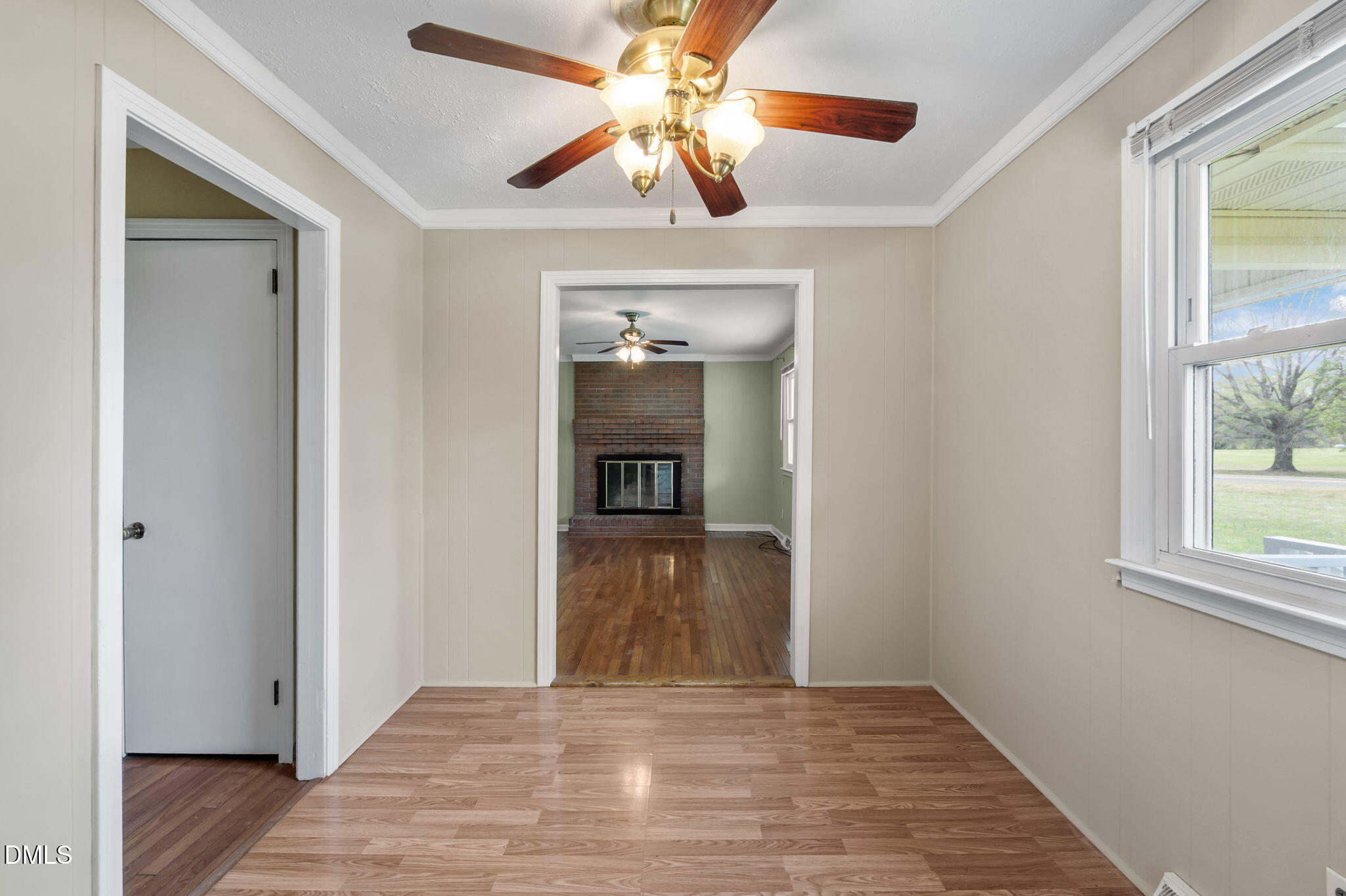 95 Harold Gill Road Roxboro, NC 27574 - Photo 15 of 53 a view of a hallway to a window and a chandelier fan in a room