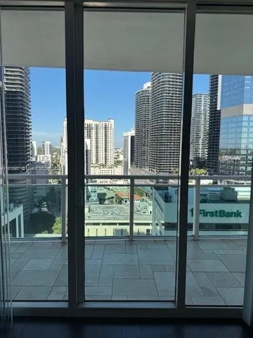 a view of a balcony with a floor to ceiling window