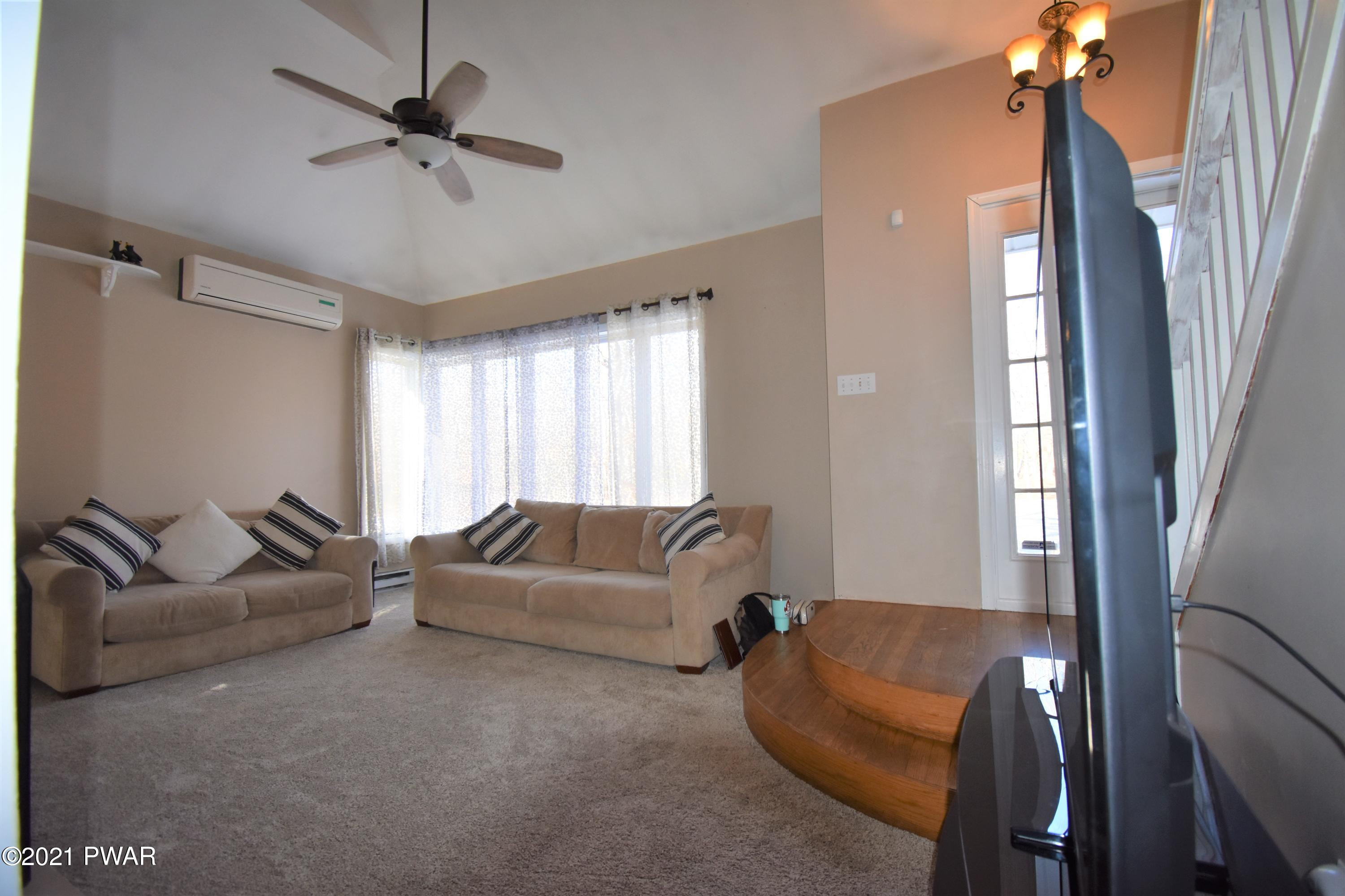244 Fox Road Dingmans Ferry, PA 18328 - Photo 7 of 31 a living room with furniture and a window