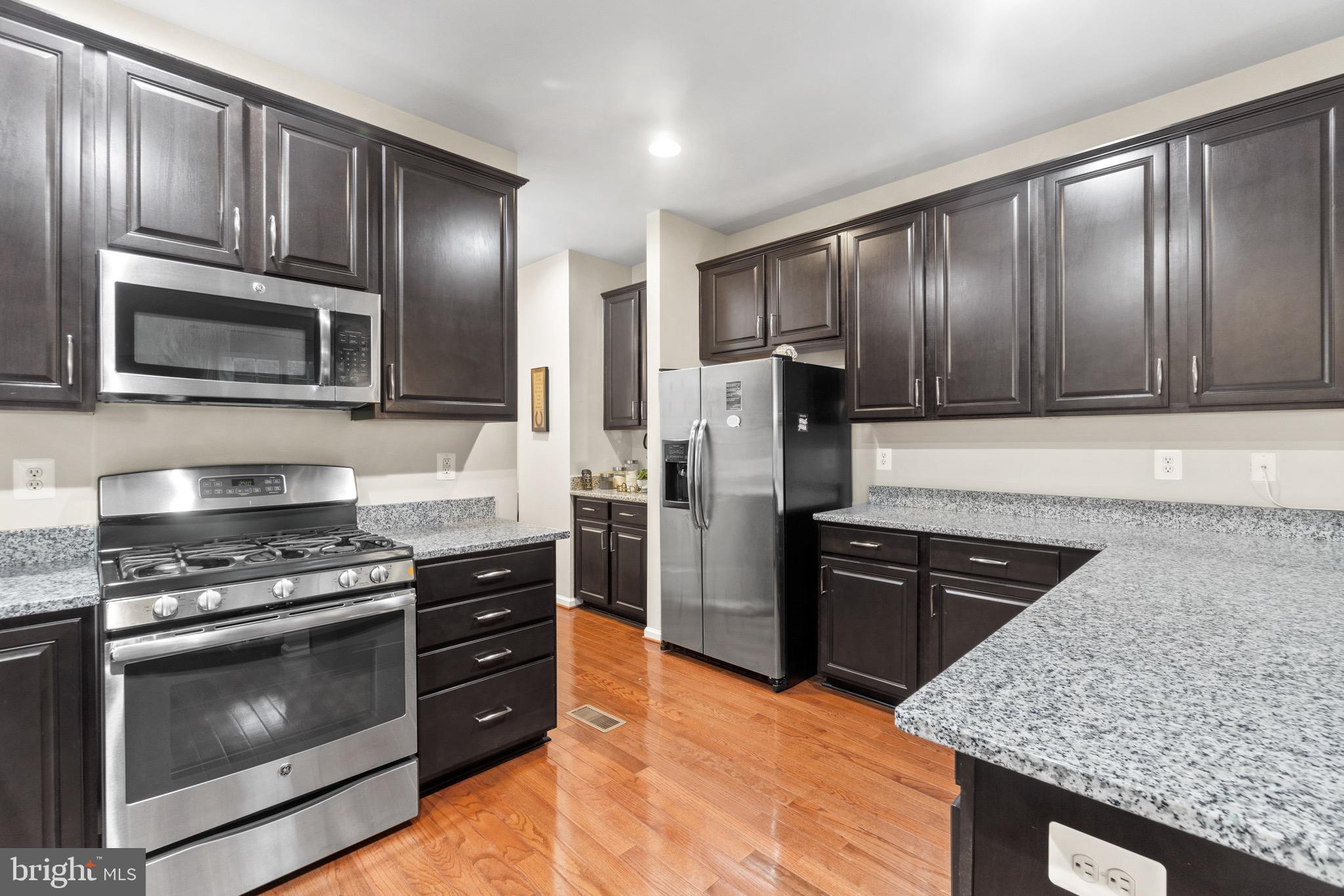 7905 Silver Oak Road Hanover, MD 21076 - Photo 5 of 25 Gourmet kitchen w/ granite and stainless steel!