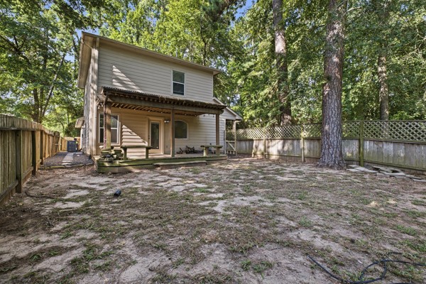 13396 Teel Road Montgomery, TX 77356 - Photo 40 of 50 a view of house with backyard and deck
