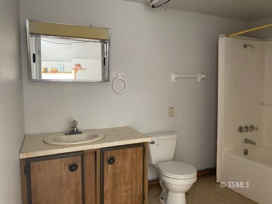 3713 Goat Ranch Road Mountain Mesa, CA 93240 - Photo 42 of 43 a bathroom with a sink toilet and a mirror